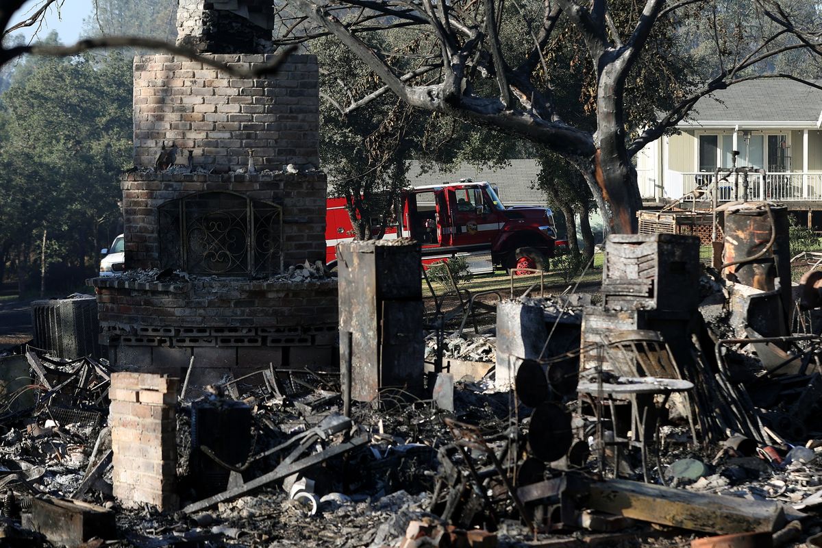 A burned home that was destroyed by the Thompson fire on Wednesday in Oroville, Calif.  (Justin Sullivan)