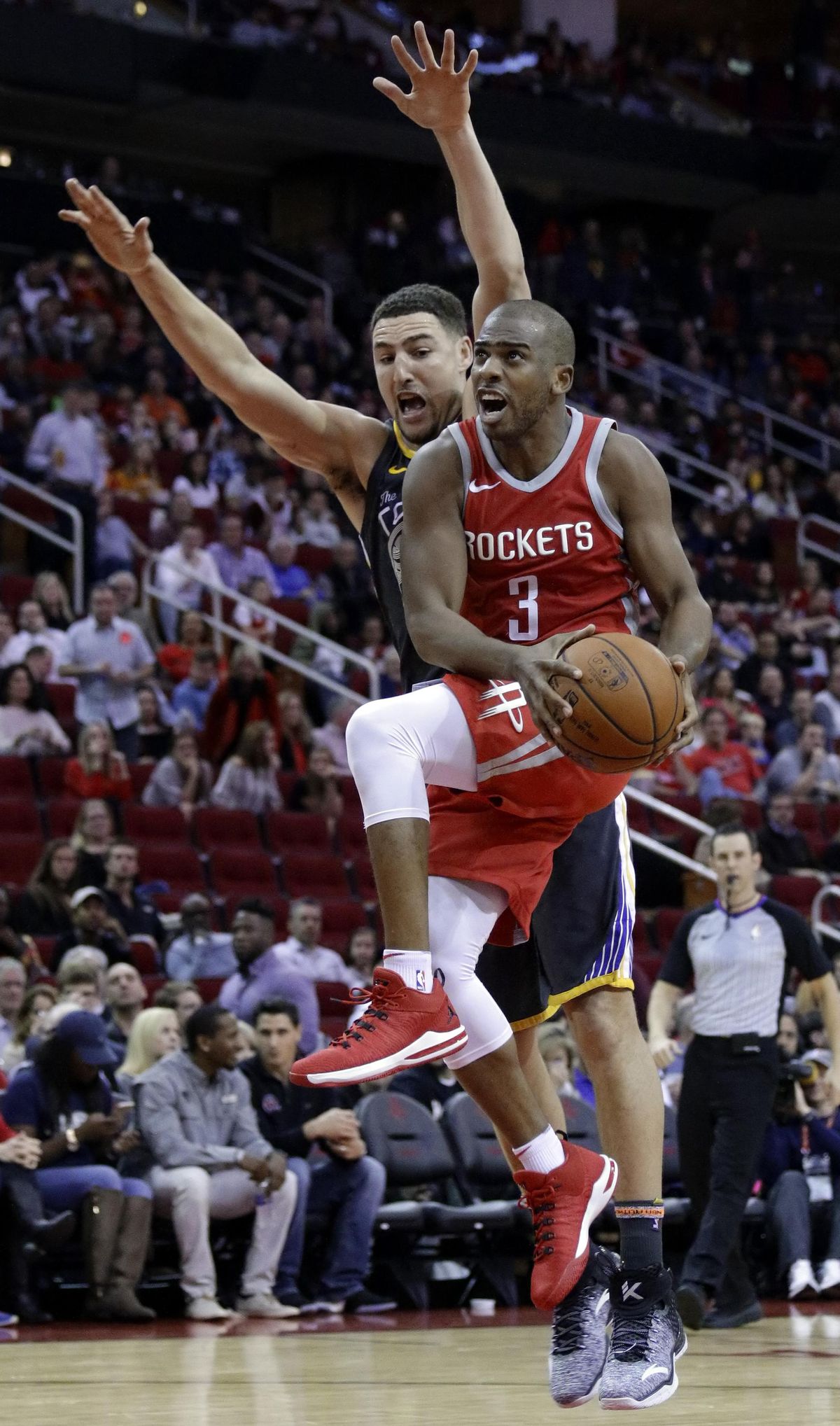 In this Jan. 20, 2018, file photo, Houston Rockets guard Chris Paul (3) shoots in front of Golden State Warriors guard Klay Thompson (11) during the second half of an NBA basketball game, in Houston. The buildup to this Golden State-Houston matchup in the Western Conference finals started in February, when Draymond Green had some pointed comments. Or in October, when the Rockets beat the Warriors on ring night. Or in June, when Chris Paul got traded. Whatever the case, the series that everyone in the NBA apparently wanted to see is about to happen. (Michael Wyke / Associated Press)