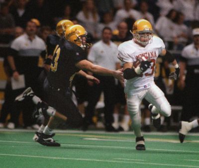 Montana’s Joe Douglass eludes  Idaho’s defense during a 1995 game  in Moscow, Idaho. (Craig Buck / File photo)