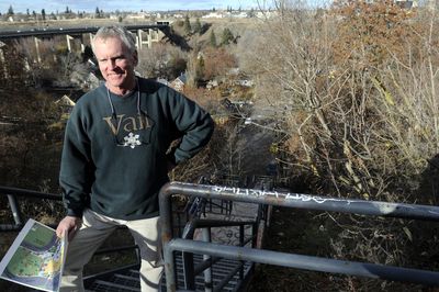 Mick McDowell stands on the Cedar Street stairs, a ’70s-era project that allows pedestrians access between Riverside Avenue above and Peaceful Valley below.  (Jesse Tinsley / The Spokesman-Review)