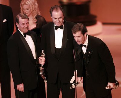 FILE - Mel Gibson, right, accepts the award for Best Picture for 