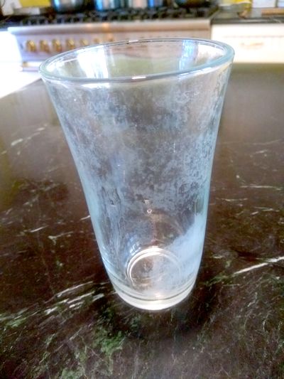 This drinking glass used to be crystal clear. A name brand dishwashing gel helped ruin it. (Tim Carter)