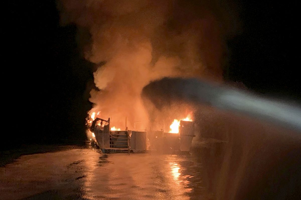 In this Sept. 2, 2019 photo provided by the Ventura County Fire Department, VCFD firefighters respond to a fire aboard the Conception dive boat fire in the Santa Barbara Channel off the coast of Southern California. Family members of the 34 people killed in a fire aboard a scuba diving boat off the California coast two years ago have sued the U.S. Coast Guard for lax enforcement of safety regulations. The lawsuit filed late Wednesday, Sept. 1, 2021, says the Coast Guard has repeatedly certified passenger boats that are fire traps.  (HOGP)