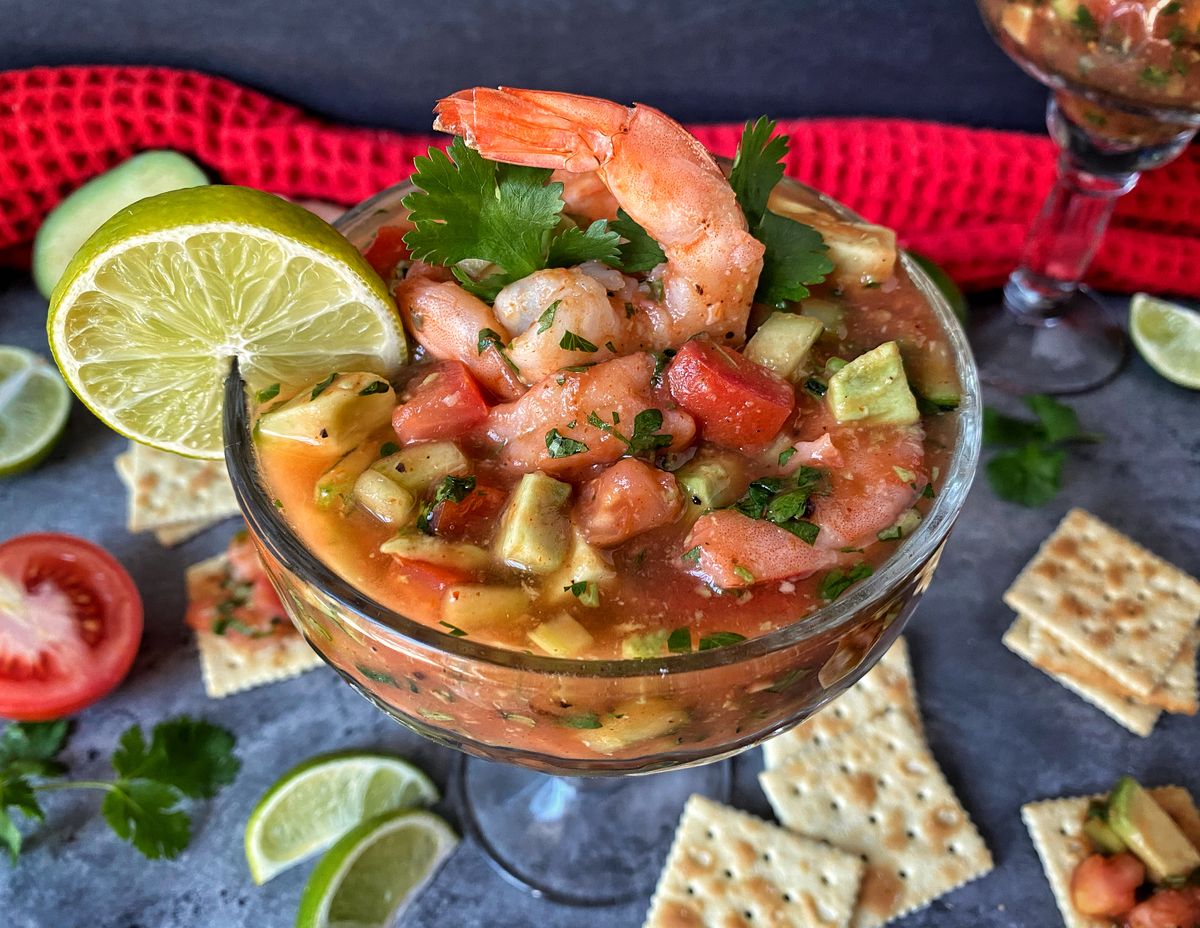 This Mexican shrimp cocktail is a vibrant dish chock-full of plump shrimp and crunchy vegetables swimming in a zesty lime tomato sauce. (Audrey Alfaro/For The Spokesman-Review)