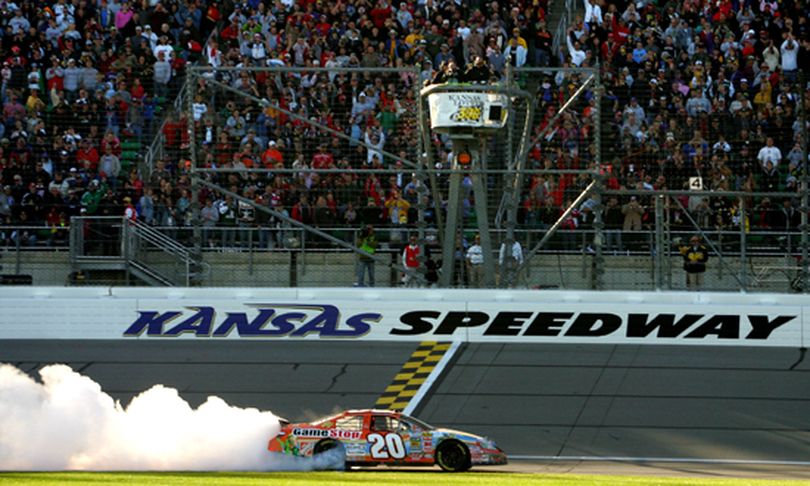 Joey Logano, driver of the No. 20 GameStop/Our House Party Toyota, does a burnout after winning Saturday's NASCAR Nationwide Series Kansas Lottery 300 at the Kansas Speedway in Kansas City, Kans. Logano, who has five career wins and four wins this season, had never won at Kansas.