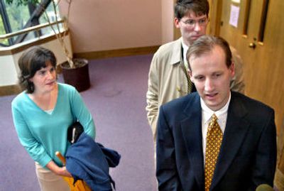 
Phil Griffin, right, attorney for Lisa Miller, left, speaks to the media in Winchester, Va.'s Joint Judicial Center in September 2004, after Miller was awarded sole custody of her then 2-year-old daughter, Isabella. 
 (File/Associated Press / The Spokesman-Review)