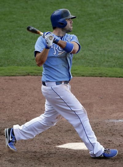 Kansas City Royals' Mike Moustakas watches his solo home run to win a baseball game during the 13th inning against the Seattle Mariners. The Royals won the game 7-6. (Associated Press)