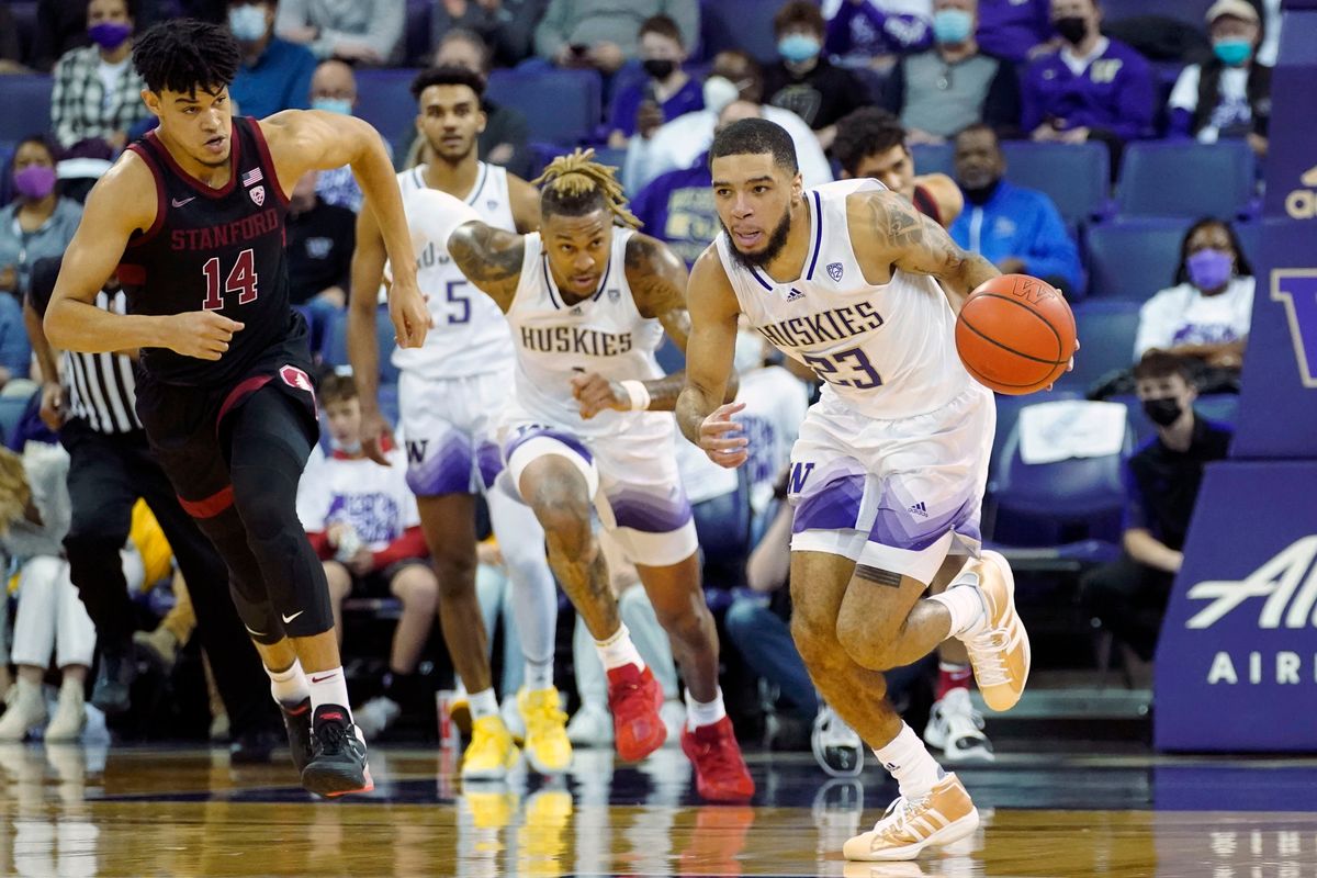 Washington guard Terrell Brown Jr., right, breaks away after a turnover as Stanford forward Spencer Jones looks on Saturday in Seattle.  (Associated Press)