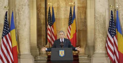 
President  Bush speaks at the National Bank of Savings in Bucharest, Romania, on Wednesday. Bush is in Romania for the final NATO summit of his presidency. Associated Press
 (Associated Press / The Spokesman-Review)