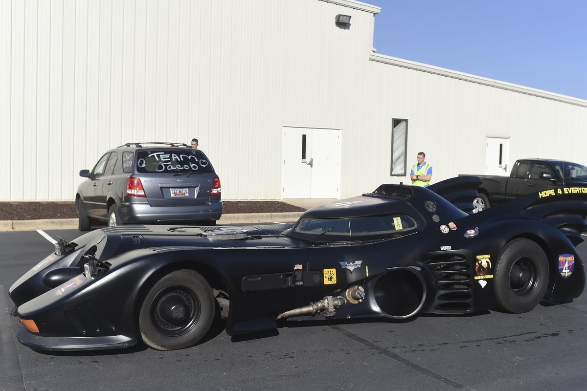 A Batmobile arrives before a superhero-themed funeral service for Jacob Hall, a six-year-old boy who was killed in a school shooting, at Oakdale Baptist Church on Wednesday, Oct. 5, 2016, in Townville, S.C. Hall