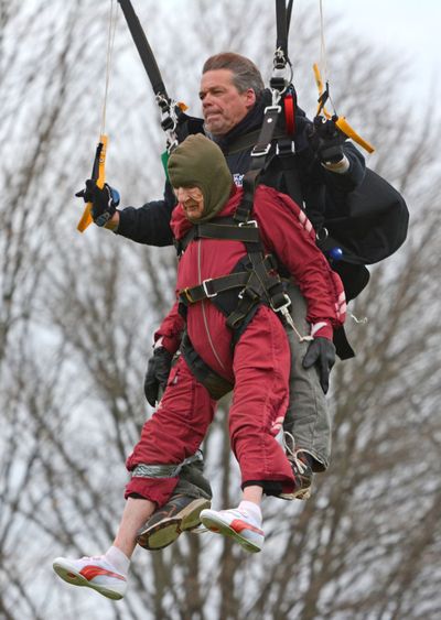 Eleanor Cunningham and tandem master Dean McDonald make a safe landing at Saratoga Skydiving Adventures in Gansevoort, N.Y., on Saturday. (Associated Press)