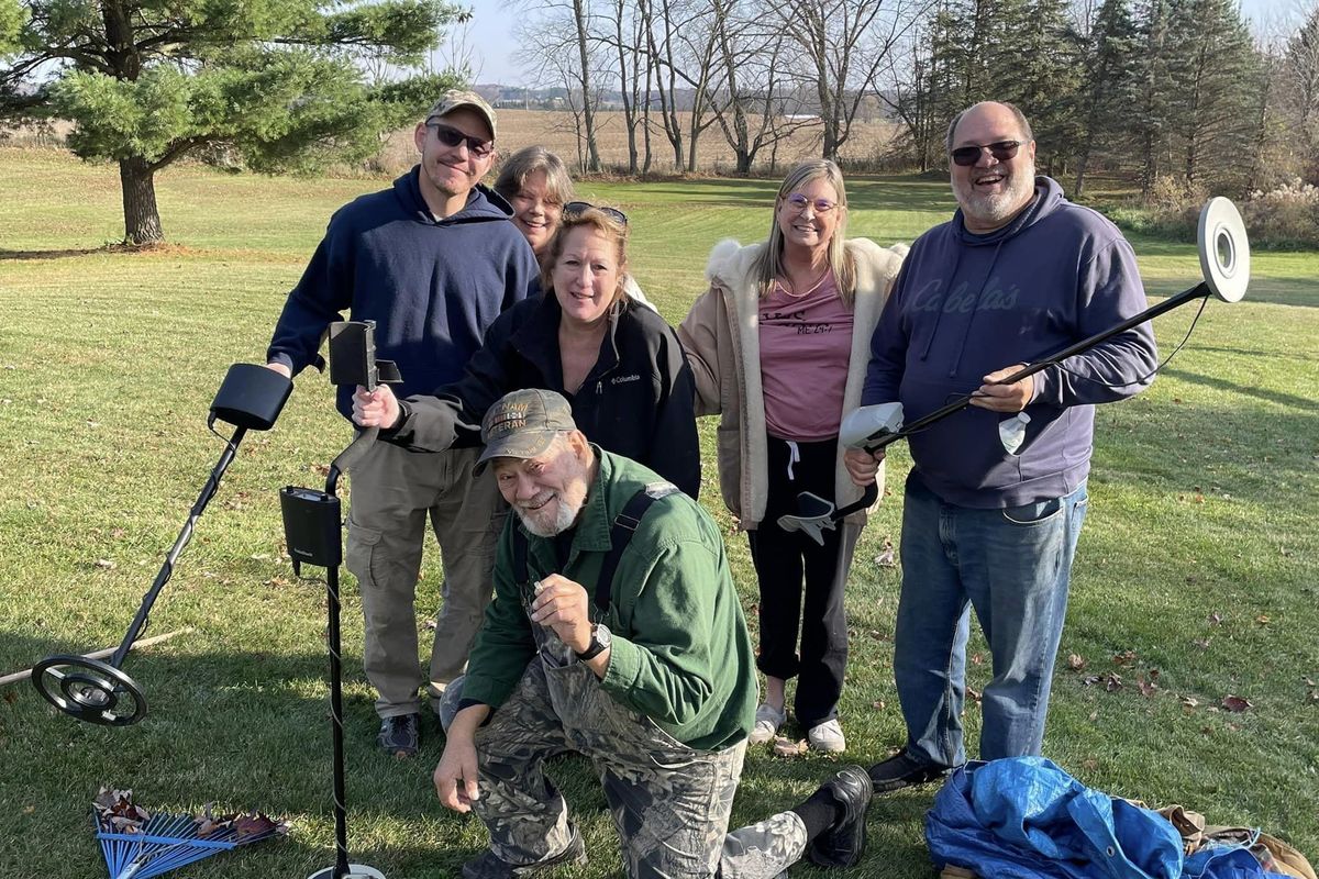 After Joseph Novetske, center, lost his wedding band Nov. 4, several people, including strangers, showed up to help him find it in his yard in Charlotte, Mich. Back row, from left, are Joel, Paula, Kathy, Lisa and Jim. (Courtesy of Mary Ann Novetske)