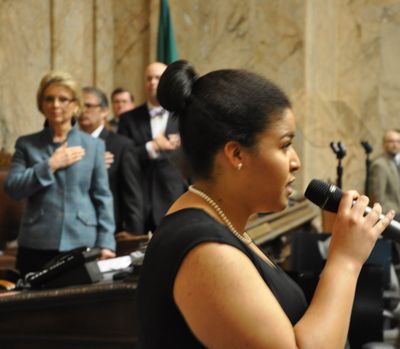 OLYMPIA -- Sofia Smith, 15, of Seattle, sings the National Anthem before Gov. Chris Gregoire delivers her State of the State speech.