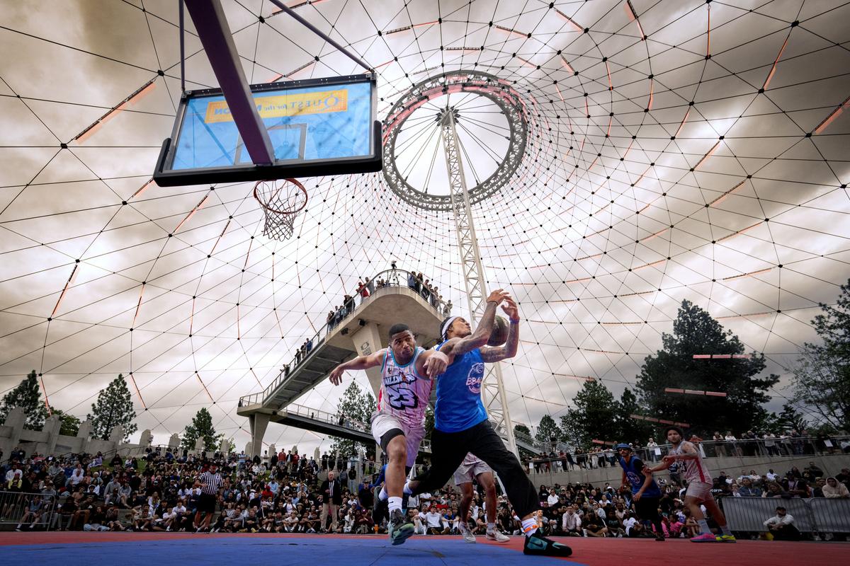 BB4LIFE’s Markieth Brown Jr. loses control of the ball as Millwood’s Alfie Miller adds defensive pressure under the basket during the Hoopfest 6-foot Under Championship on Center Court, Sunday, June 28, 2026. (COLIN MULVANY /THE SPOKESMAN-REVIEW)