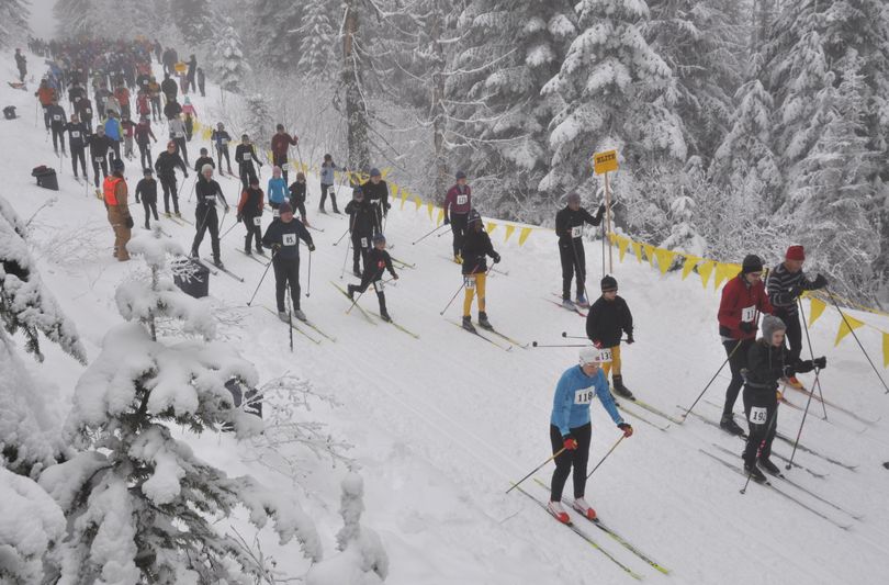 Skiers take off in the mass start for 250 competitors in the 34th annual Langlauf 10-kilometer cross-country ski race Sunday at Mount Spokane. The fastest skiers through the foggy conditions were Brad Bauer, 38, of Seattle, the overall winner in 27:33, and Deb Bauer, 46, of Spokane, the top female in 33:01. (Rich Landers)
