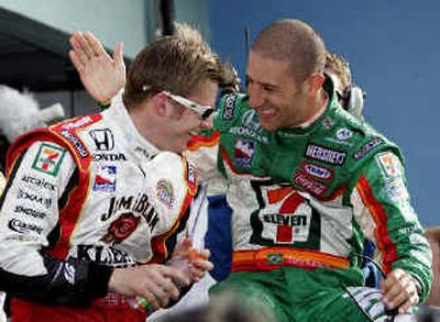 
Dan Wheldon, left, celebrates his win with driver Tony Kanaan after the Indy 300.
 (Associated Press / The Spokesman-Review)