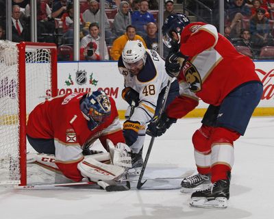 Florida Panthers defenseman Jason Demers, right, helps defend the net as Florida Panthers goaltender Roberto Luongo, left, stops a shot by Buffalo Sabres left wing William Carrier during the second period of an NHL hockey game, Tuesday, Dec. 20, 2016, in Sunrise, Fla. (Joel Auerbach / Associated Press)