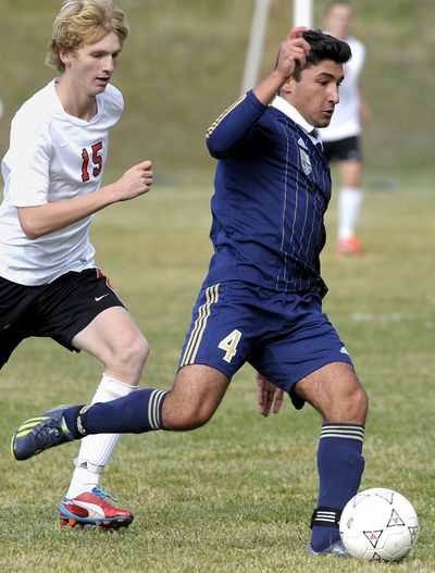 Diren Dede, right, plays in a soccer game last October. The 17-year-old exchange student was shot to death Sunday in a Missoula garage. (Associated Press)