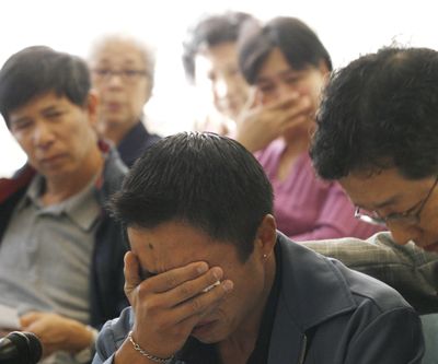 Jason Loui, whose stepfather was killed in the 1983 Chinatown massacre, struggles to compose himself while speaking at a parole hearing for Wai-Chiu “Tony” Ng’s 12th robbery count in 2006. A parole board is now considering whether to let Ng begin serving the sentence on his final robbery count.  (File Associated Press)