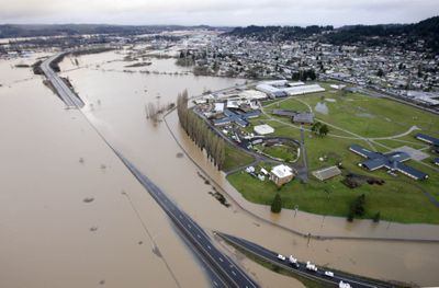 Interstate 5 is submerged by flood waters from the Chehalis River on Thursday in Chehalis, Wash.  (Associated Press / The Spokesman-Review)