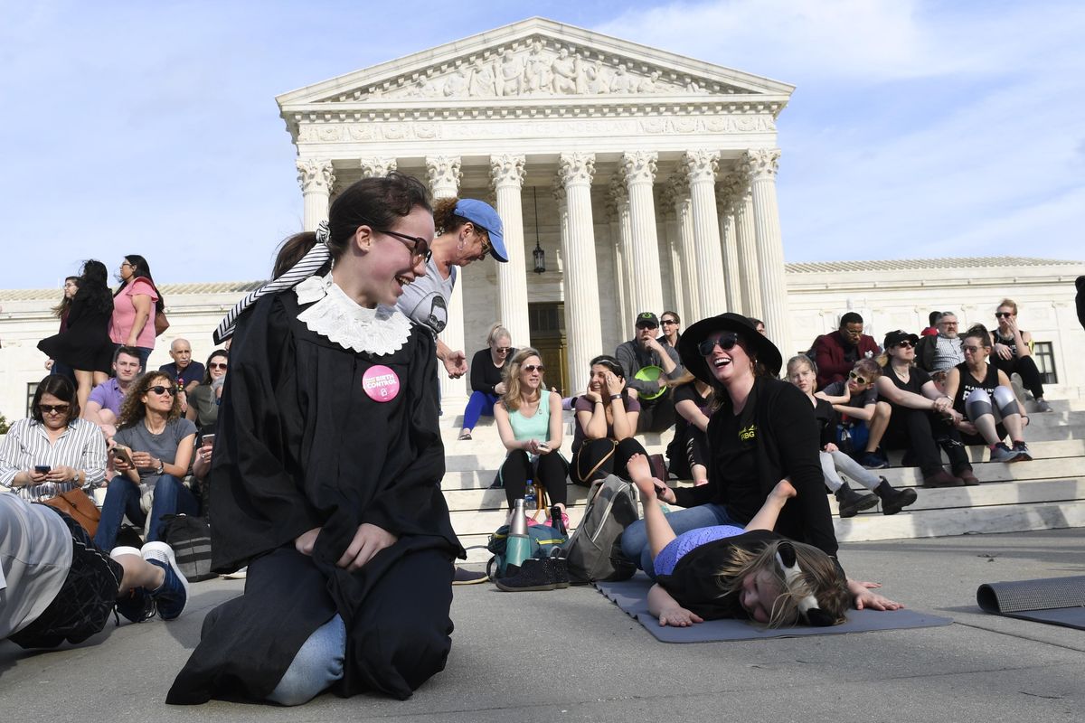Alice Wisbiski, dressed as Supreme Court Associate Justice Ruth Bader Ginsburg, is joined by others as a group do exercises on the steps of the Supreme Court in Washington, Friday, March 15, 2019, to celebrate Ginsburg’s upcoming birthday 86th birthday. (Susan Walsh / Associated Press)
