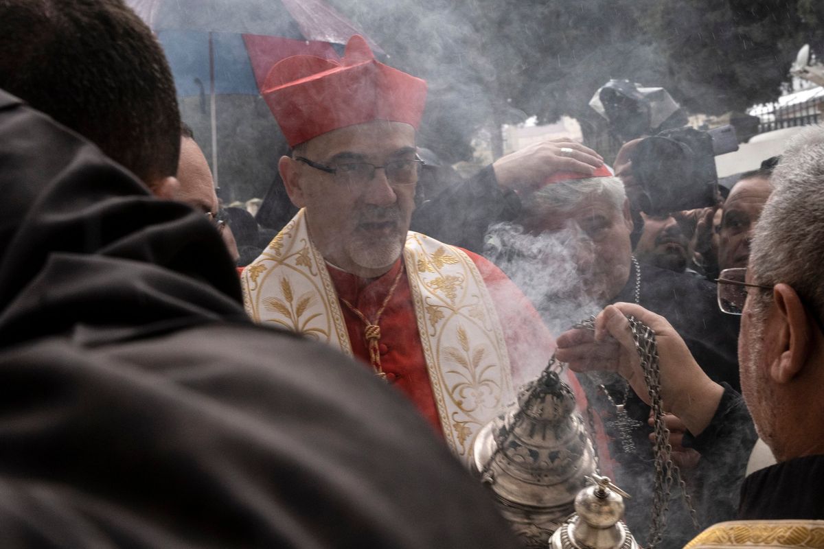 The Latin Patriarch Pierbattista Pizzaballa, the top Catholic cleric in the Holy Land, arrives at Bethlehem’s Church of the Nativity on Tuesday in the West Bank. (Heidi Levine/For The Washington Post)