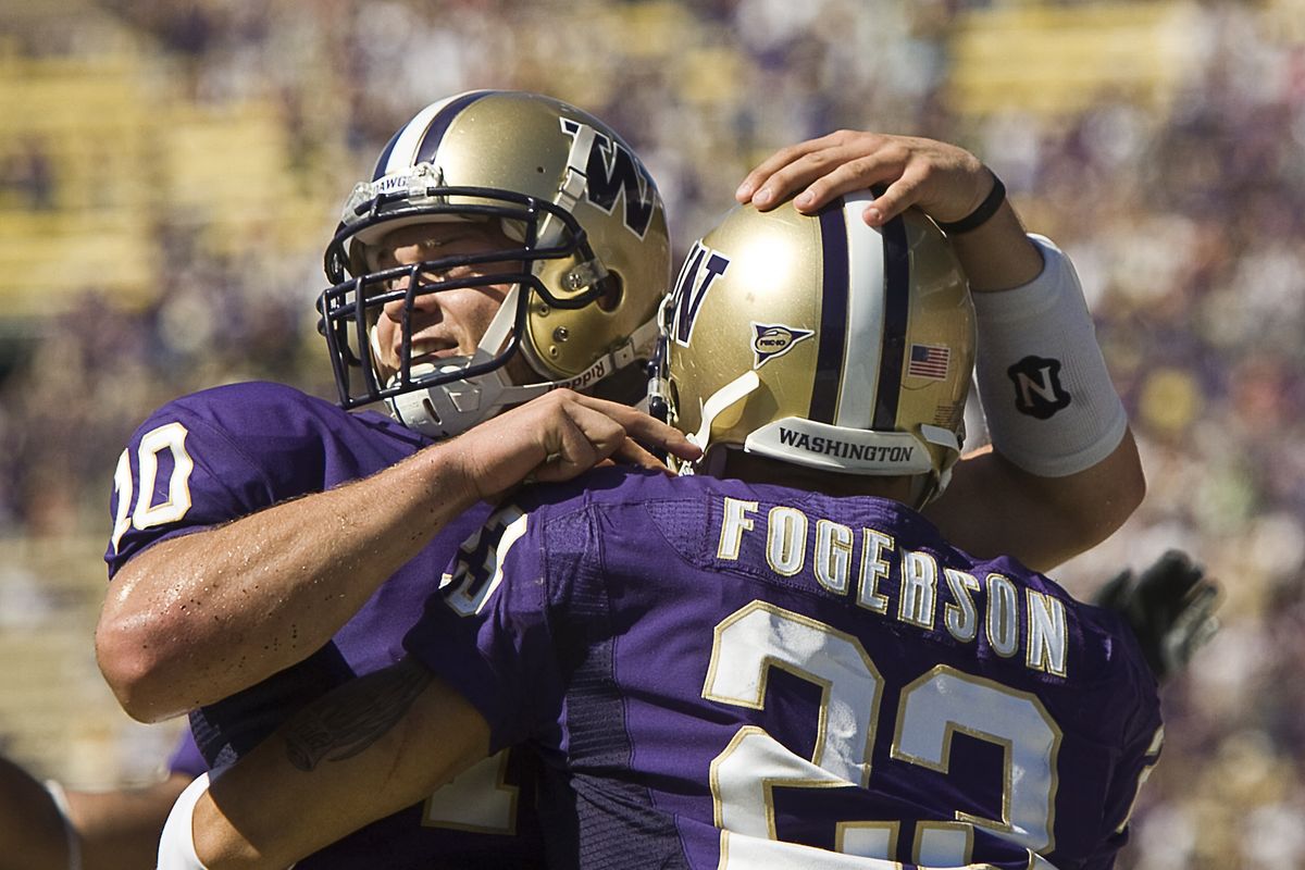 Washington QB Jack Locker, left, and RB Johri Fogerson celebrate a first-half TD.  (Associated Press / The Spokesman-Review)