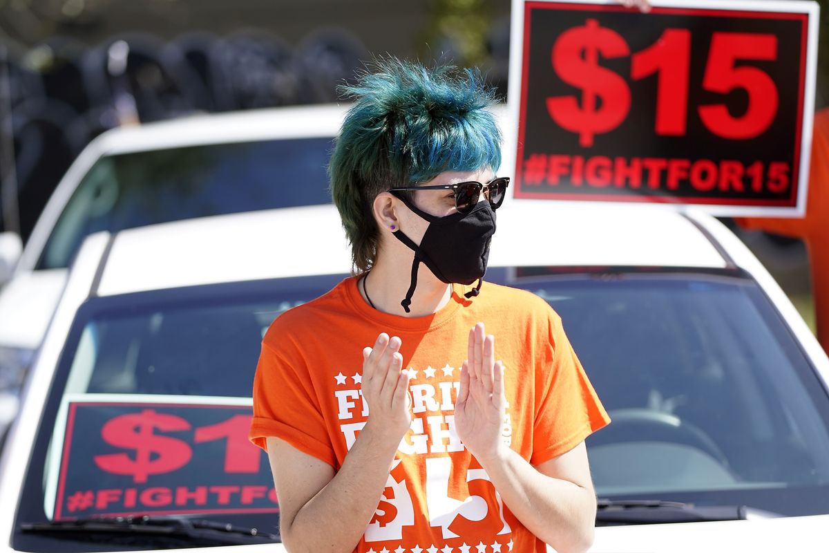 Cristian Cardona, an employee at a McDonald’s, attends a rally for a $15 an hour minimum wage Tuesday in Orlando, Fla.  (John Raoux)