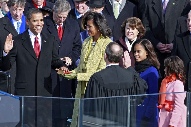 Barack Obama is sworn in by Chief Justice John Roberts as the 44th president of the United States on the West Front of the Capitol as his wife Michelle looks on Tuesday,  Jan. 20, 2009 in Washington.    (Mark Wilson / The Spokesman-Review)