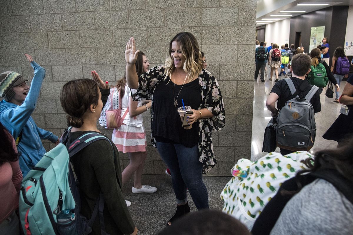 Salk Middle School seventh-grad teacher Kendall Erickson welcomes students back on the first day of school in the new school building, Aug. 31, 2017. Dan Pelle/THE SPOKESMAN-REVIEW (Dan Pelle / The Spokesman-Review)