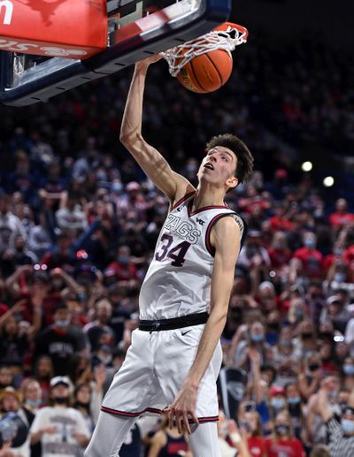 Gonzaga center Chet Holmgren dunks the ball Friday in the McCarthey Athletic Center. Holmgren had seven dunks against Bellarmine in the Zags’ 92-50 victory.  (Colin Mulvany / The Spokesman-Review)