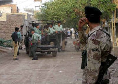 
Pakistani troops arrive at a hideout of a suspected top al Qaeda operative in Nawabshah, Pakistan, on Monday. 
 (Associated Press / The Spokesman-Review)