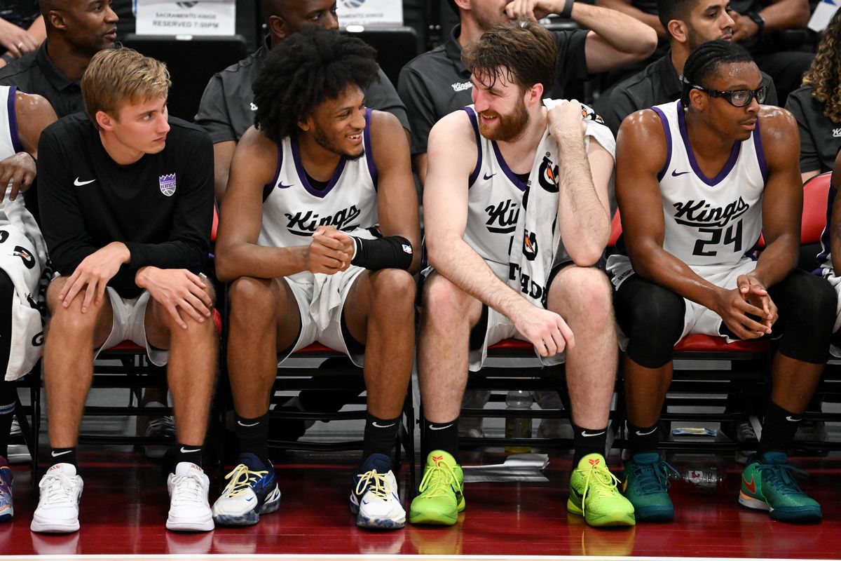Sacramento center Drew Timme (46) and forward Issac Jones (17) laugh on the bench during an NBA Summer League matchup against Utah on Monday, Jul. 15, 2024, at Cox Pavilion in Las Vegas, Nev.  (Tyler Tjomsland/The Spokesman-Review)