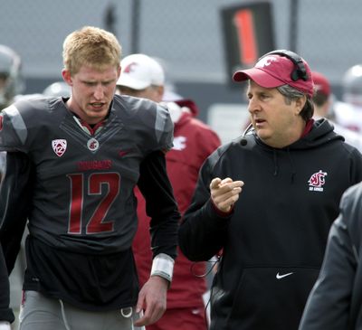Washington State quarterback Connor Halliday and coach Mike Leach talk it over during the Crimson and Gray Game on April 20, 2013, at Joe Albi Stadium. (Dan Pelle / The Spokesman-Review)
