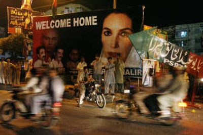
Supporters of Pakistan's former Prime Minister Benazir Bhutto gather outside her family home in Karachi on Wednesday. Associated Press
 (Associated Press / The Spokesman-Review)
