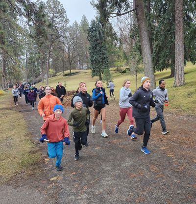 Runners hit the trail in Spokane’s annual Turkey Trot ahead of feasting this Thanksgiving Day in Manito Park.  (Amanda Sullender / The Spokesman-Review)