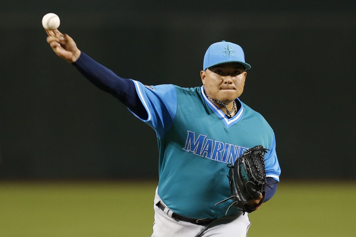 Seattle Mariners pitcher Erasmo Ramirez throws during the first inning against the Arizona Diamondbacks on Friday in Phoenix. (Rick Scuteri / AP)