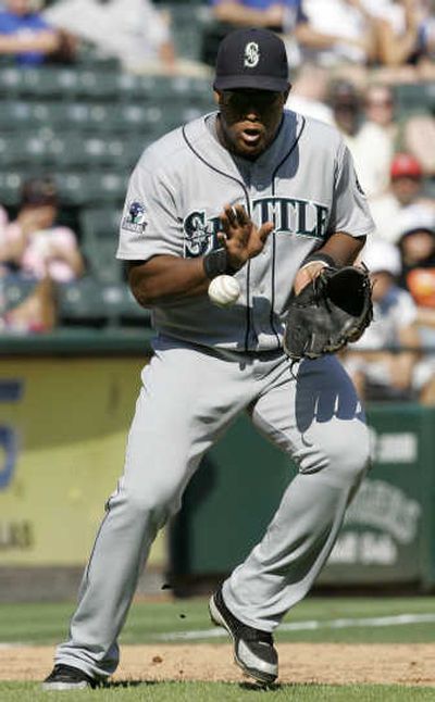 
Seattle's Adrian Beltre fields Desi Relaford's grounder. 
 (Associated Press / The Spokesman-Review)