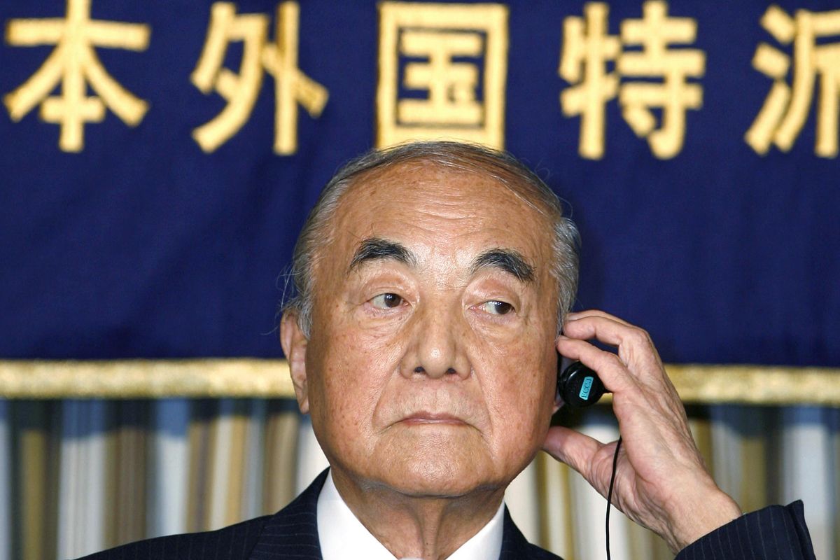 In this March 23, 2007,  photo, former Japanese Prime Minister Yasuhiro Nakasone adjusts earphone during a press conference in Tokyo. Nakasone, a giant of his country’s post-World War II politics, died on Friday, Nov. 29, 2019. He was 101. (Shuji Kajiyama / Associated Press)