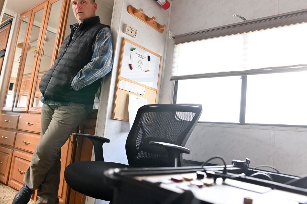 SPD Lt. Dan Waters stands Wednesday in the close quarters of the 1999 motor home the department uses for its hostage negotiations team in Spokane. The motor home is showing its age with water damage, a rodent infestation and nonergonomic working spaces.  (Tyler Tjomsland/The Spokesman-Review)