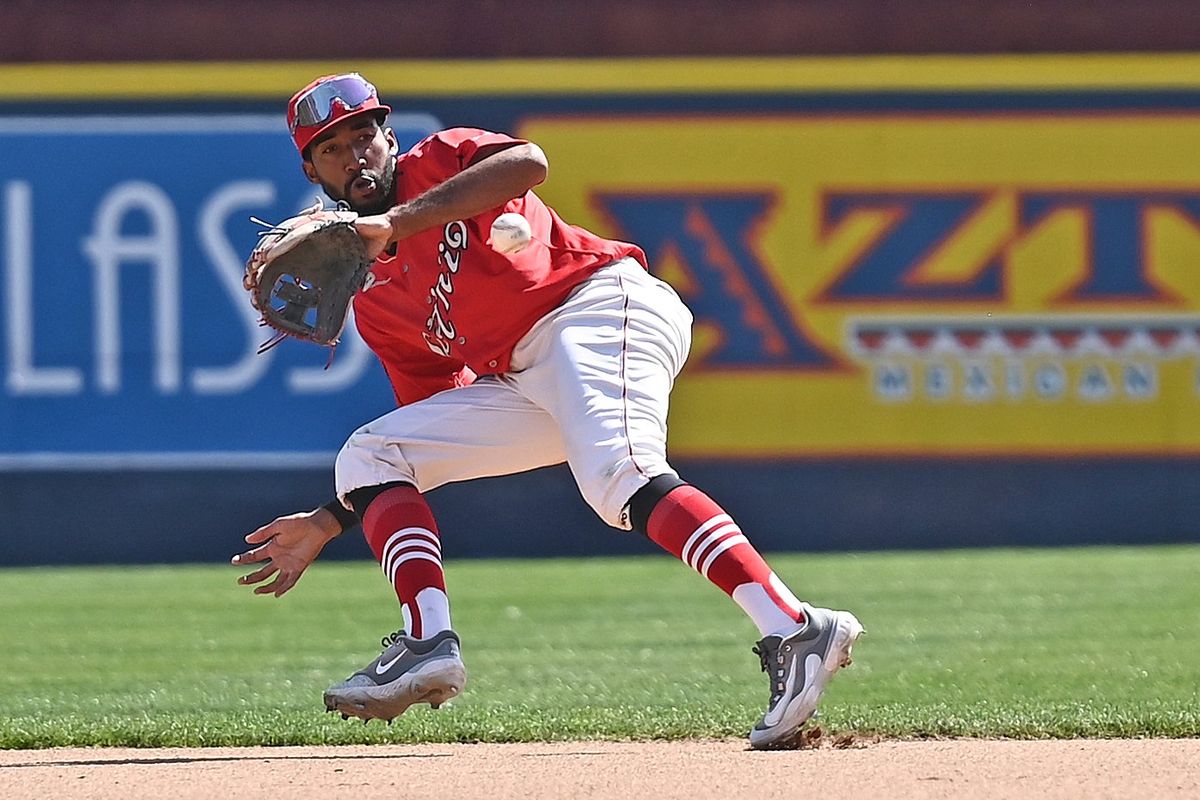 Spokane Indians infielder Cristopher Navarro fields a ball against the Everett AquaSox during a NWL baseball game at Avista Stadium on Sunday.  (James Snook)