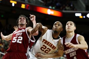 WSU’s Caleb Forrest, left, and Klay Thompson battle USC’s Taj Gibson for position.  (Associated Press / The Spokesman-Review)