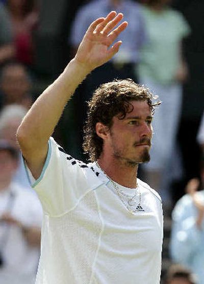 
 Marat Safin waves after straight-sets triumph over  Mark Philippoussis. 
 (Associated Press / The Spokesman-Review)