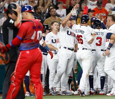 Team USA celebrates Sunday after Paul Goldschmidt’s homer during the World Baseball Classic semifinal.  (Tribune News Service)