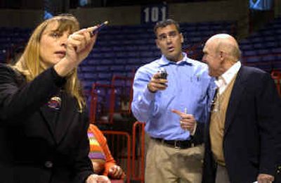 Skating promoter Barb Beddor, Greg Johnston, of United States Skating, and Doug Wilson, of ABC-TV, discuss the Spokane Arena's layout Thursday in anticipation of the 2007 U.S. Figure Skating Championships.
(Jed Conklin / The Spokesman-Review)