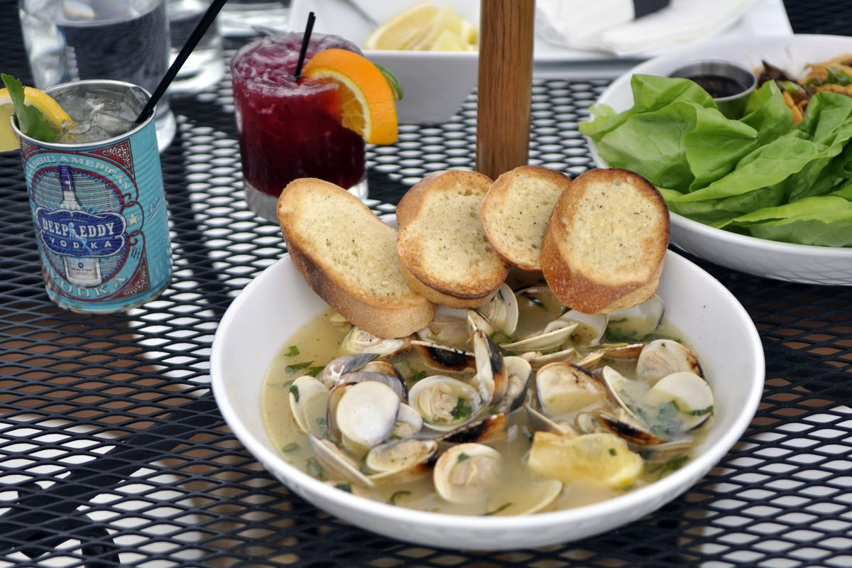 Appetizers, including these clams, are $4 off during happy hour at Remedy on the South Hill. Signature drinks are $7 and mules are $6. (Adriana Janovich / The Spokesman-Review)