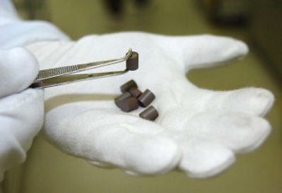 
A worker prepares fuel pellets for a nuclear reactor last month at the uranium processing plant of Industrias Nucleares do Brasil S.A. in Resende, 91 miles west of Rio de Janeiro. 
 (Associated Press / The Spokesman-Review)