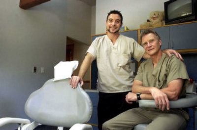 
Dr. James McNamara, right, started his Rathdrum dental practice in 1977. He now works there with his son, Nick, also a dentist. 
 (Jesse Tinsley / The Spokesman-Review)