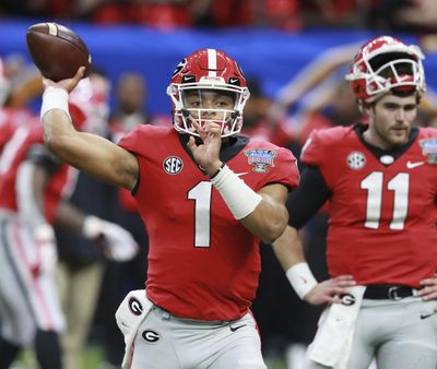 In this Jan. 1, 2019, photo, Georgia quarterback Justin Fields (1) warms up for the Sugar Bowl in New Orleans. (Curtis Compton / Atlanta Journal Constitution via AP)