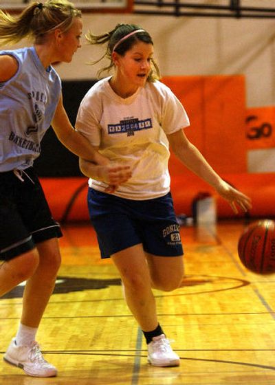 
WVHS junior Krystal McCarthy, right, runs the ball during practice last week.
 (Liz Kishimoto / The Spokesman-Review)